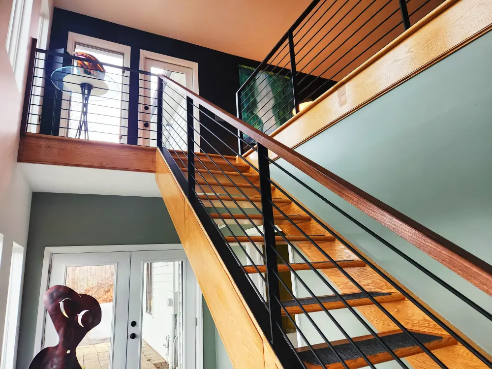 Custom metal railing with Black Walnut top rail
