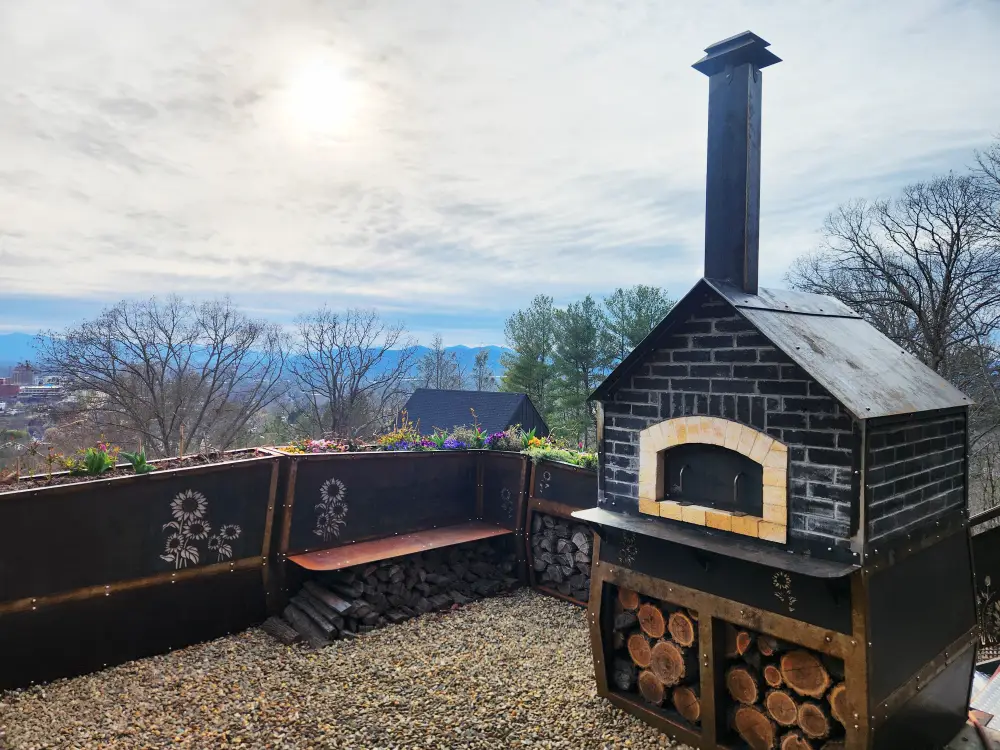 Corten Steel and Masonry Pizza Oven with Custom Siding, Roof, and Chimney. Stainless Steel Rivets and Laser Cut Design
