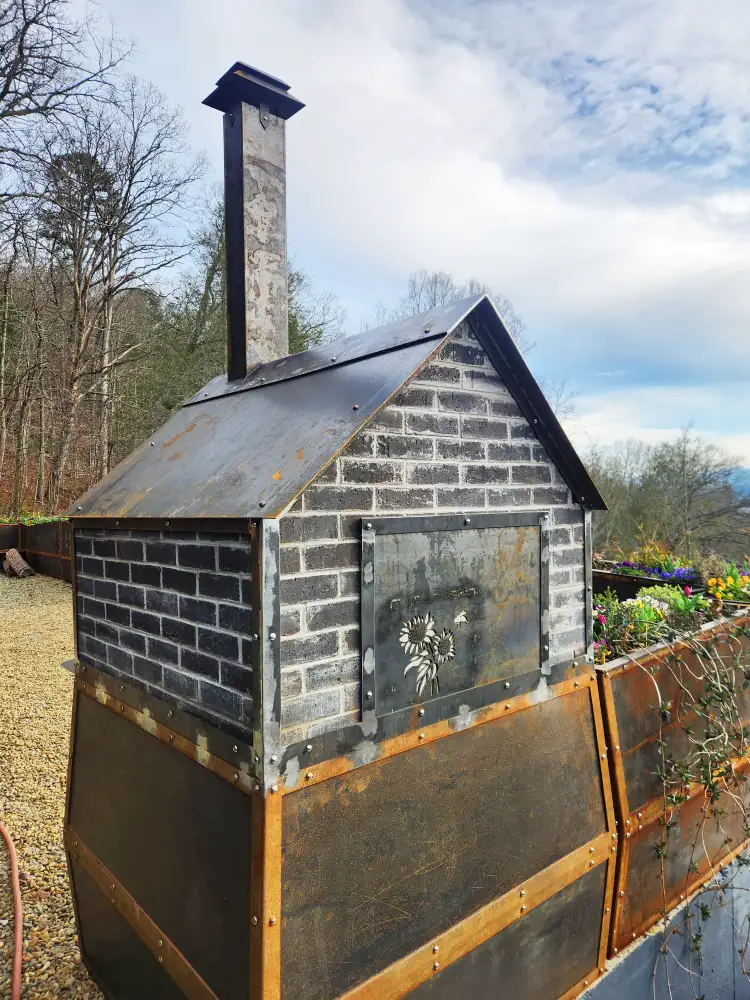 Corten Steel and Masonry Pizza Oven with Custom Siding, Roof, and Chimney. Stainless Steel Rivets and Laser Cut Design