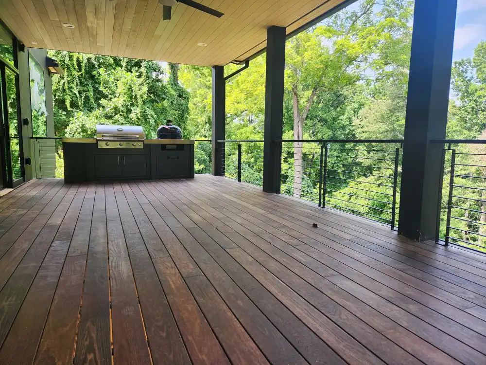 Custom powder-coated exterior deck railing with wood top rail
